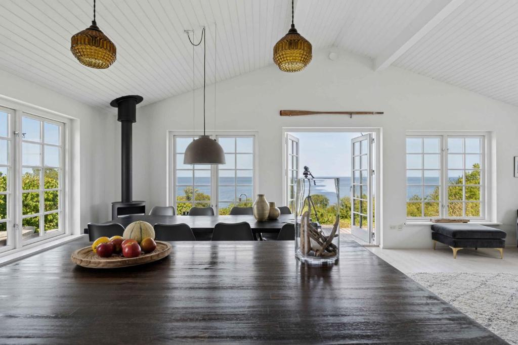 a living room with a table with fruit on the floor at Magical Sea View From Terrace To Horizon 1 in Listed