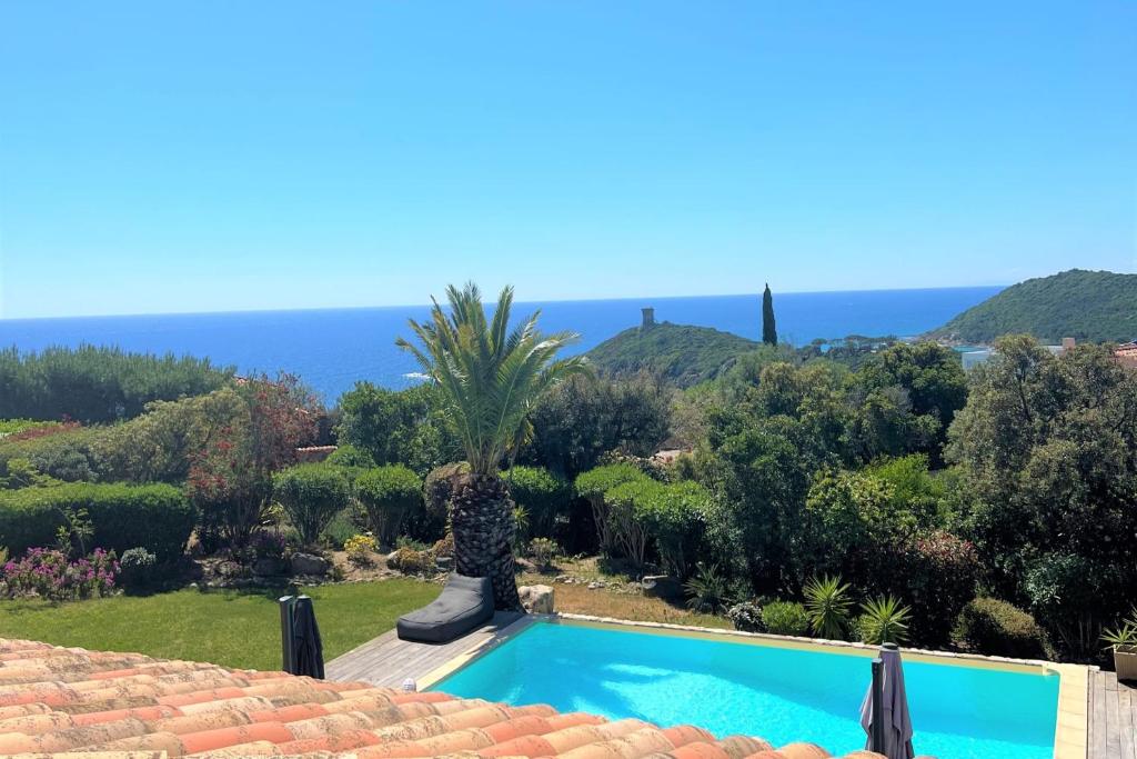 a villa with a swimming pool and a view of the ocean at Villa Surella Di Fautea in Conca