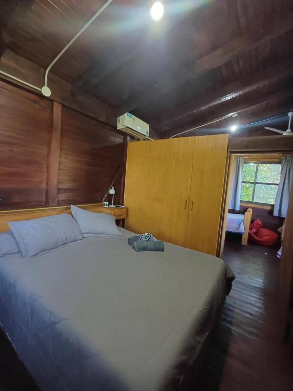 a bedroom with a large bed in a room at Bambú Cabaña in El Soberbio