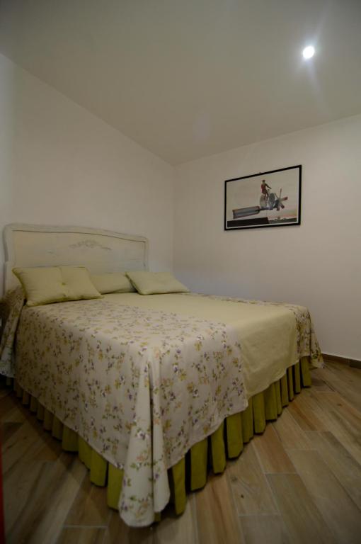 Postel nebo postele na pokoji v ubytování La Vignola Country Hotel