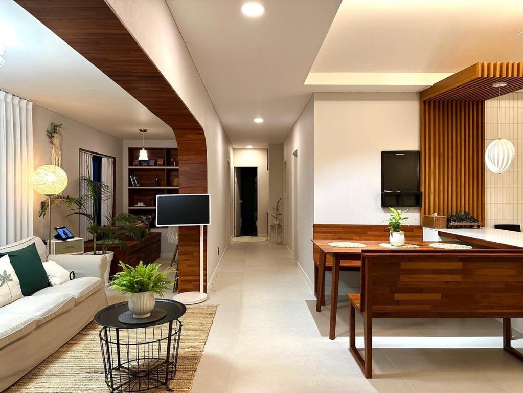 a living room with a couch and a table at Dal Dam, a pet-friendly accommodation in the west of Jeju, a private underground bunker event room for family groups in Ŭmbu-dong