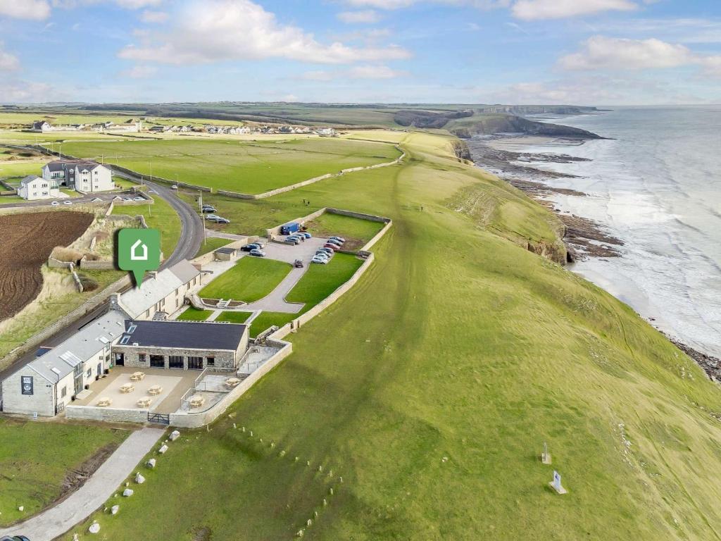 an aerial view of a building on the coast at 8 bed in Southerndown 86493 in Southerndown
