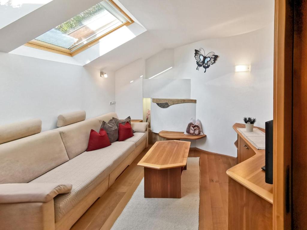 a living room with a couch and a table at Apartment Schmetterling in Collalbo