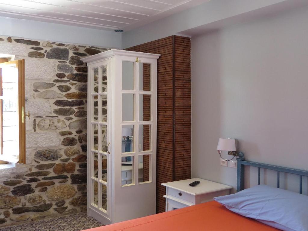 Postel nebo postele na pokoji v ubytování Mystras Inn