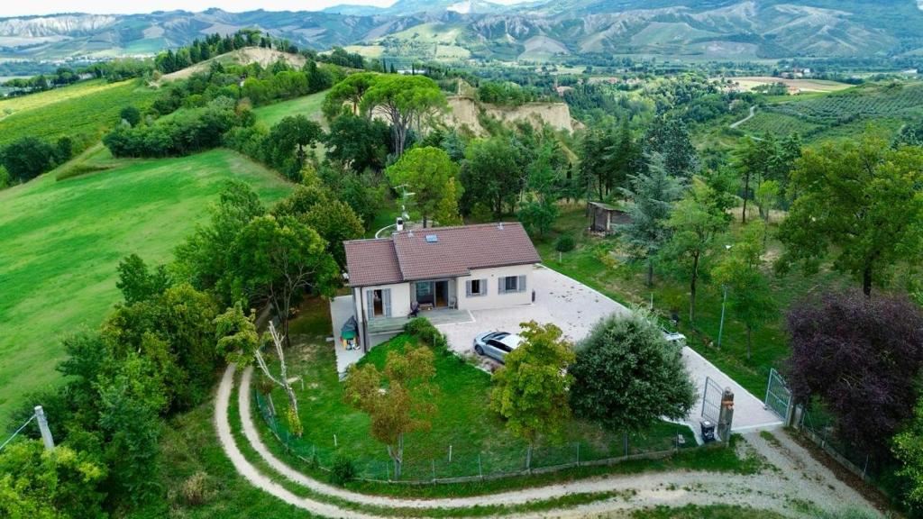 an overhead view of a house with a driveway at Villa immersa nei campi in Casal Fiumanese