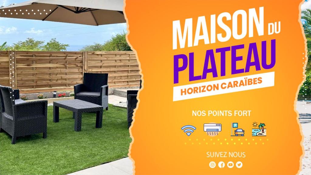 a sign for a mushroom garden with chairs and an umbrella at Maison du plateau - Horizon Caraïbes in Vieux-Habitants