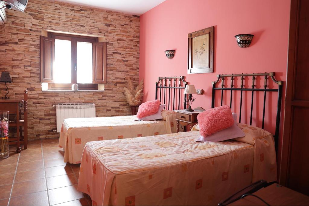 Katil atau katil-katil dalam bilik di Casa Rural La Almazara Del Cristo