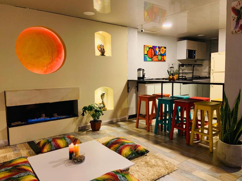 a living room with a couch and a table at Las Aguas Inner Experience in Bogotá