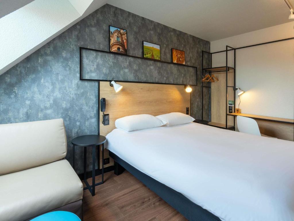 Ένα ή περισσότερα κρεβάτια σε δωμάτιο στο ibis Epernay Centre Ville