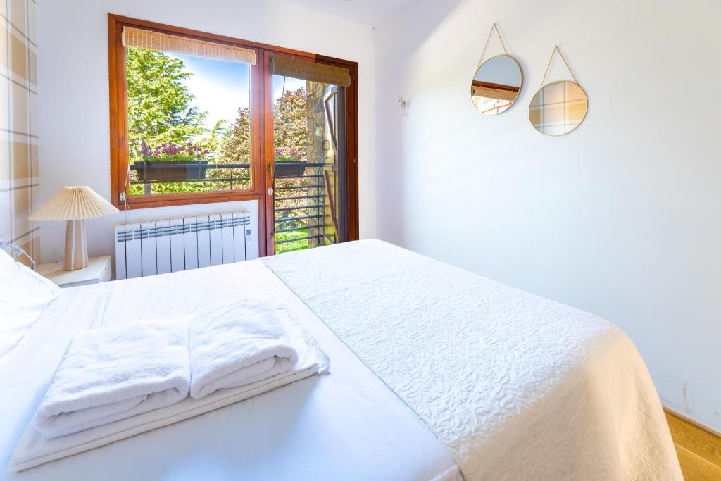 En eller flere senge i et værelse på Las casitas de mache - SALENQUES