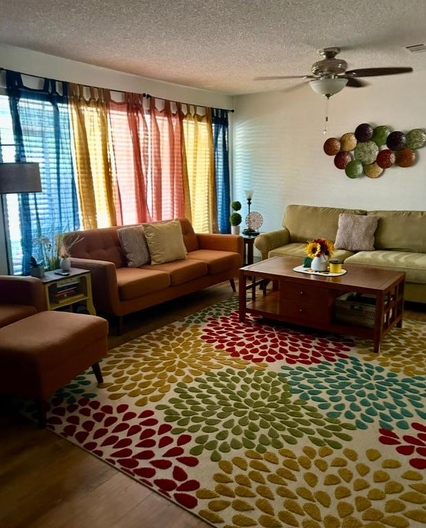a living room with a couch and a coffee table at Entire Vacation home blocks to the Strip, ARTS Dist, & Main Street Sleeps up to 8 in Las Vegas