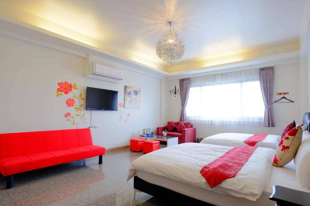 Postel nebo postele na pokoji v ubytování Redbean Guesthouse