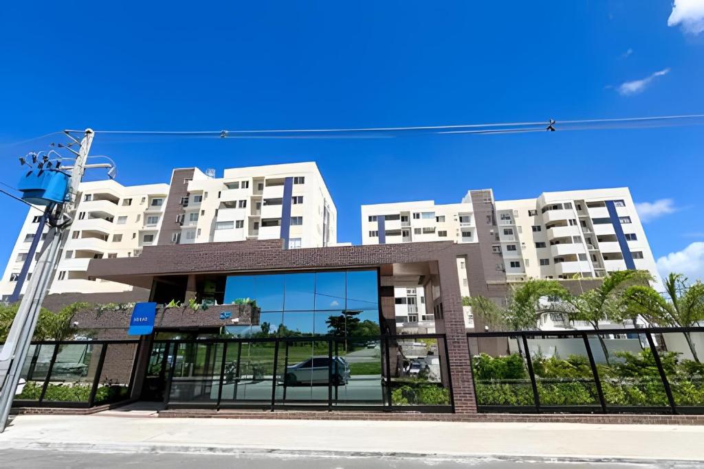 a building with a car on the front of it at Apto 2/4 com AR a 7min da Praia de Aruana in Santa Maria