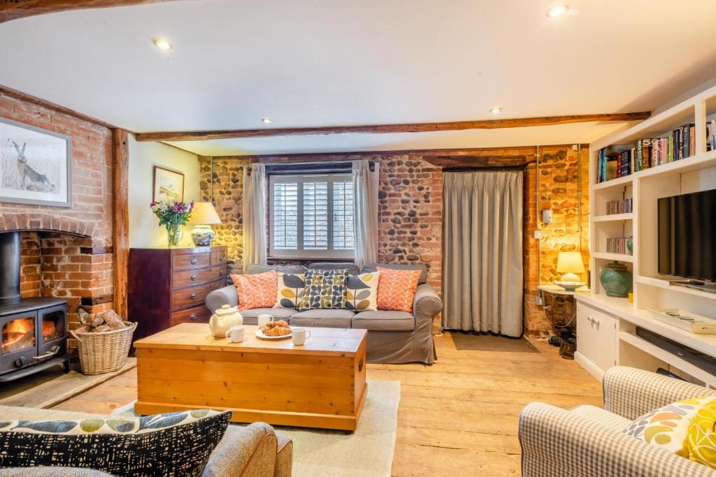 Posezení v ubytování Tawny Cottage