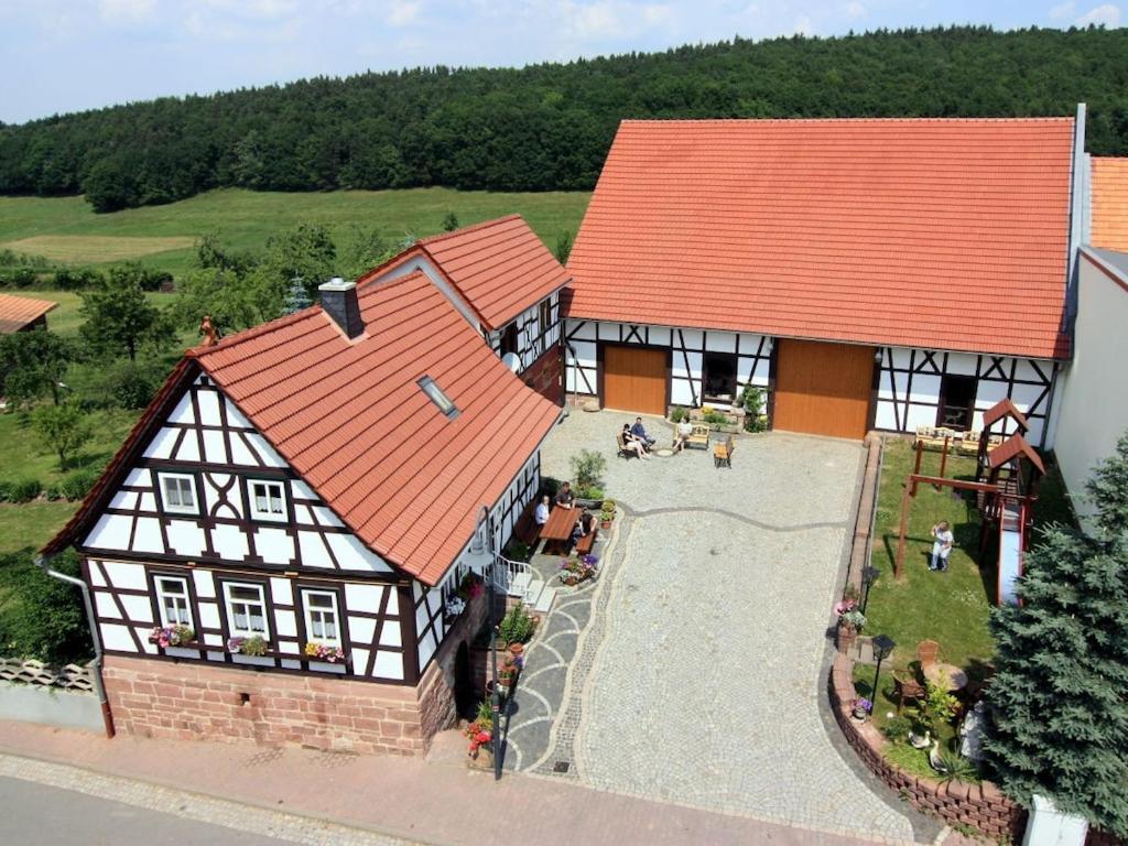 an aerial view of a house with an orange roof at One-bedroom apartment in Bernshausen