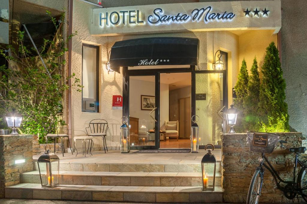 a hotel entrance with stairs in front of a building at Hotel Santa Maria in Saint-Florent