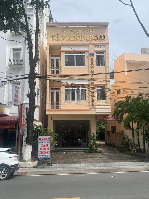 a building with a sign in front of it at Nhà nghỉ TÂN MINH THOẠI in Phu Quoc