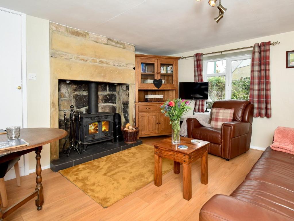 a living room with a fireplace and a couch at 1 Bed in Bellingham 89085 in Bellingham