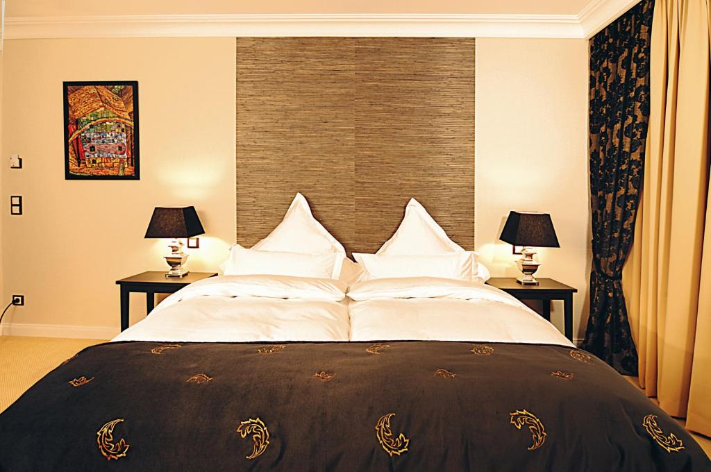 Postel nebo postele na pokoji v ubytování Hotel Business & More