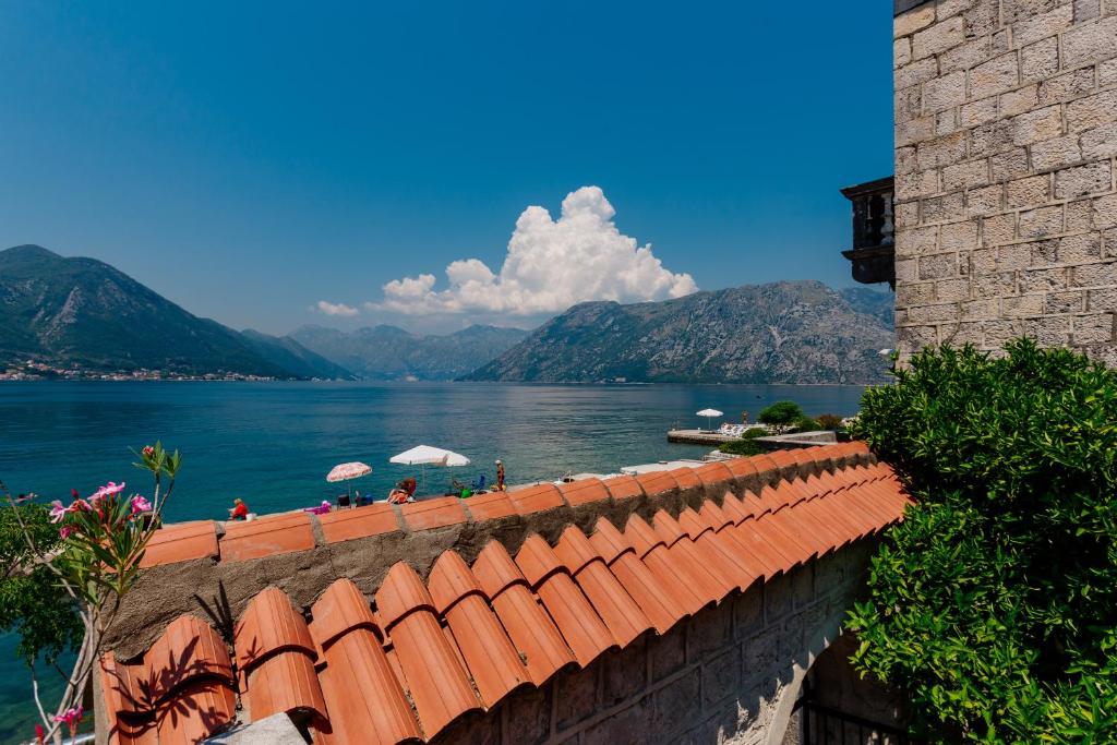 a view of a body of water from a building at Celine's Place By The Sea in Kotor