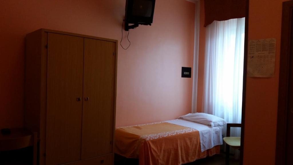 Postel nebo postele na pokoji v ubytování Hotel Ambrosi