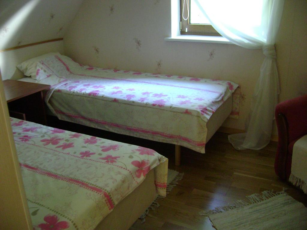 Postel nebo postele na pokoji v ubytování Mere Holiday House