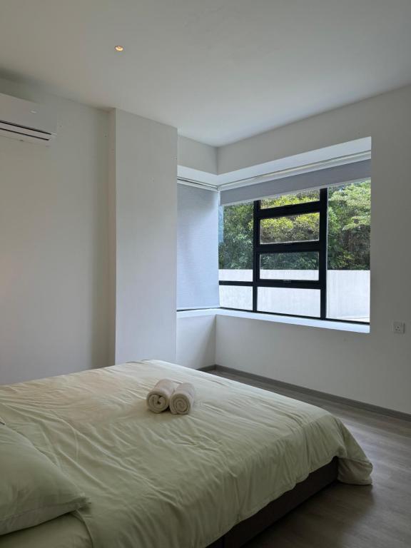 Ένα ή περισσότερα κρεβάτια σε δωμάτιο στο Vero 3-Bedroom Homestay