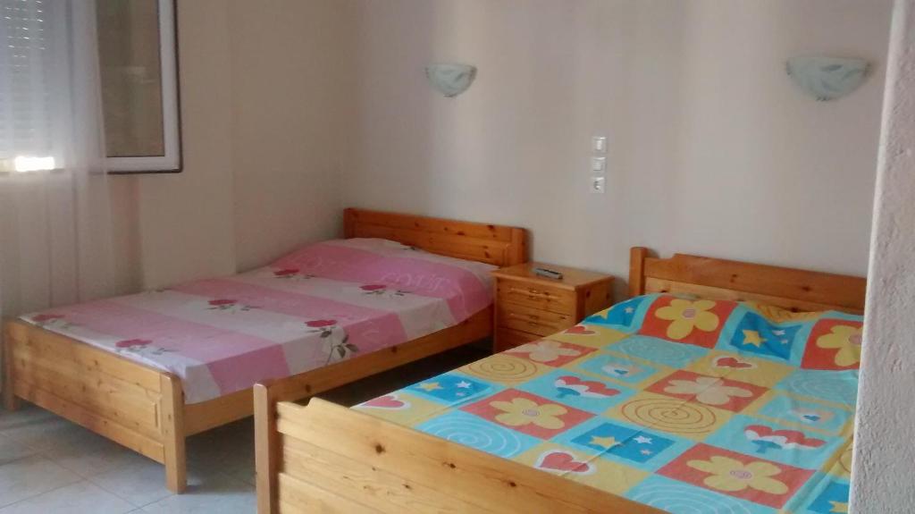 Łóżko lub łóżka w pokoju w obiekcie Apartments Christina