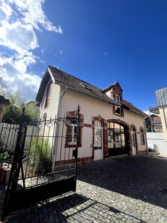 a house with a gate in front of it at Duplex City Hag in Haguenau