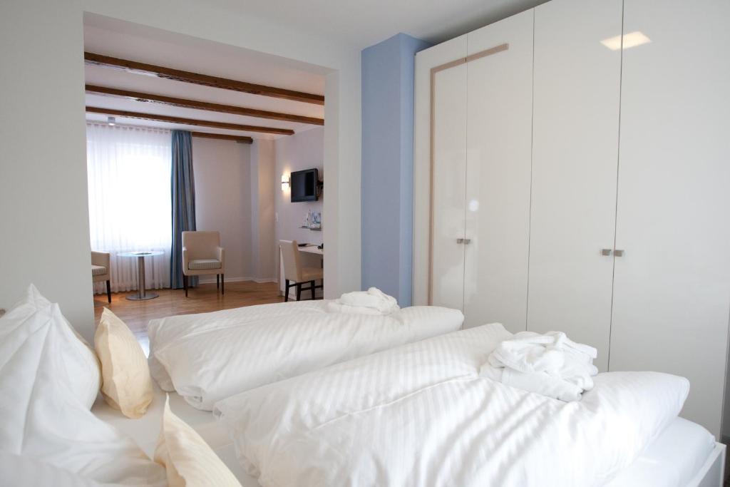 Postel nebo postele na pokoji v ubytování Frühstückshotel Seemannsbraut Amrum-adults only ab 18 Jahre-keine Haustiere-