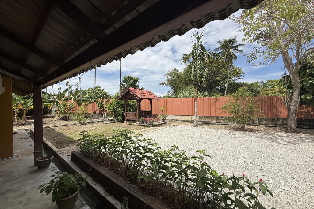 a garden with a gazebo and some plants at Inapan Taman Herba in Kepala Batas