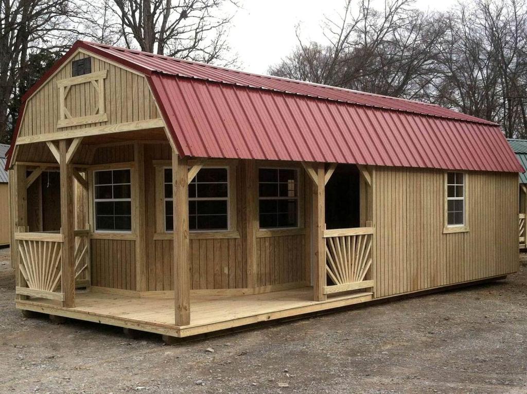a large wooden building with a red roof at Cozy Cabin on Horse Ranch near Kalispell, Montana in Kila
