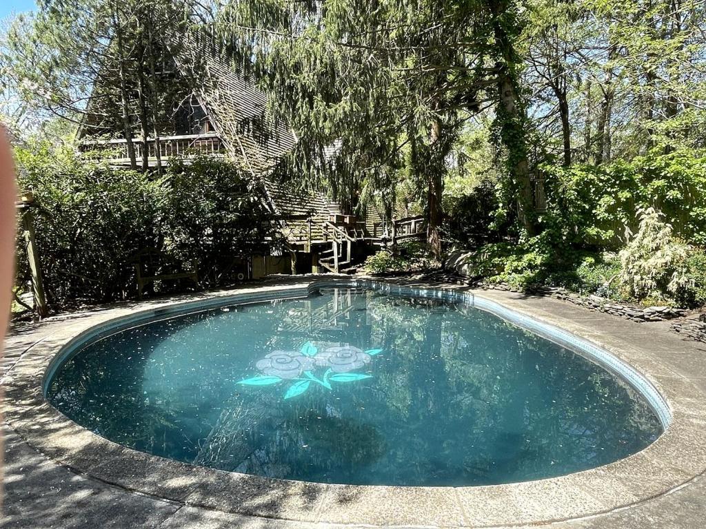 a swimming pool with a painting on it at Romantic Botanical Bell Tent for a Fantastic Glamping Experience in Southbury, Connecticut in Southbury