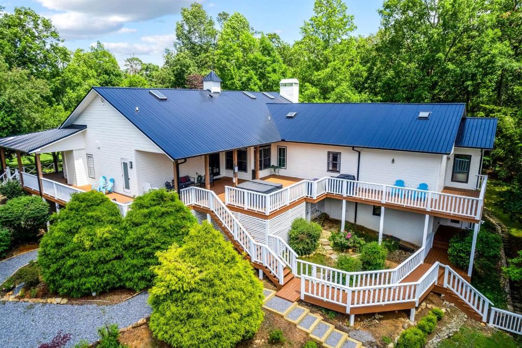 an aerial view of a white house with a blue roof at Stunning Rental with Hot-Tub, Theater Room and Great Landscape in Tennessee in Waldens Creek