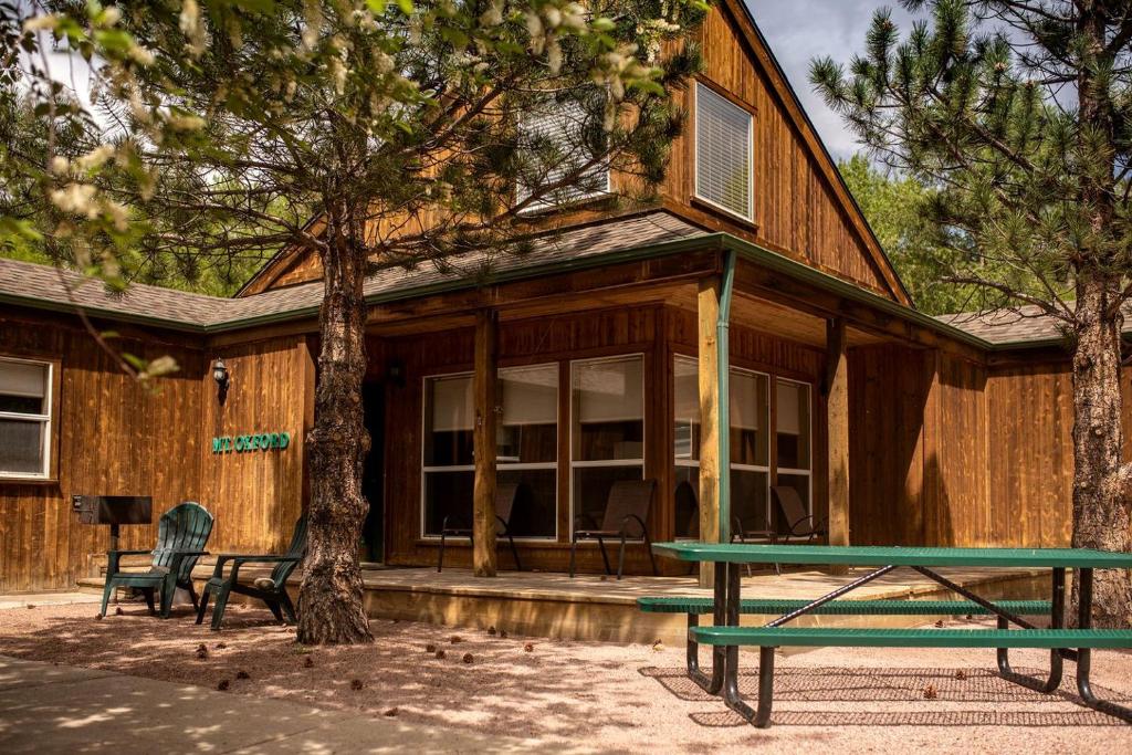 a house with a picnic table in front of it at Luxury Cabin with ATV Trails near the Continental Divide in Colorado in Monarch