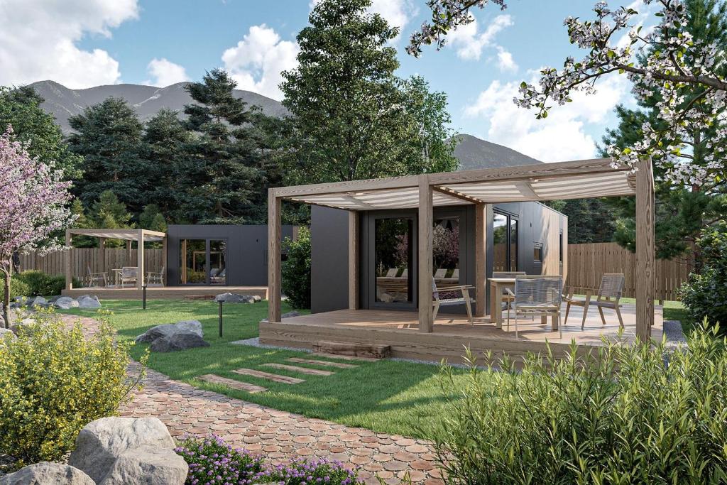 einen Pavillon mit einem Tisch und Stühlen im Garten in der Unterkunft Dreamy Austria Resort with a Stunning Pool in Unterlibitsch