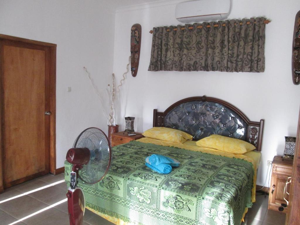 Postel nebo postele na pokoji v ubytování Yuli's Homestay