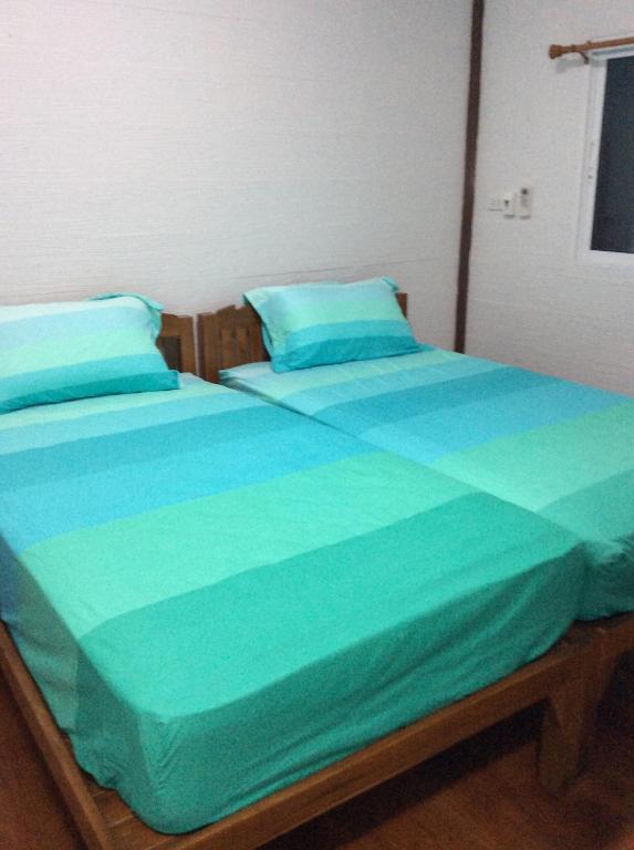 Postel nebo postele na pokoji v ubytování Sorn Waree Home place