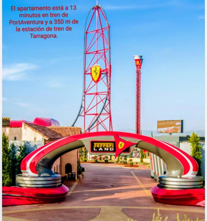 a roller coaster in front of a amusement park at Apartament Melpomeny in Tarragona