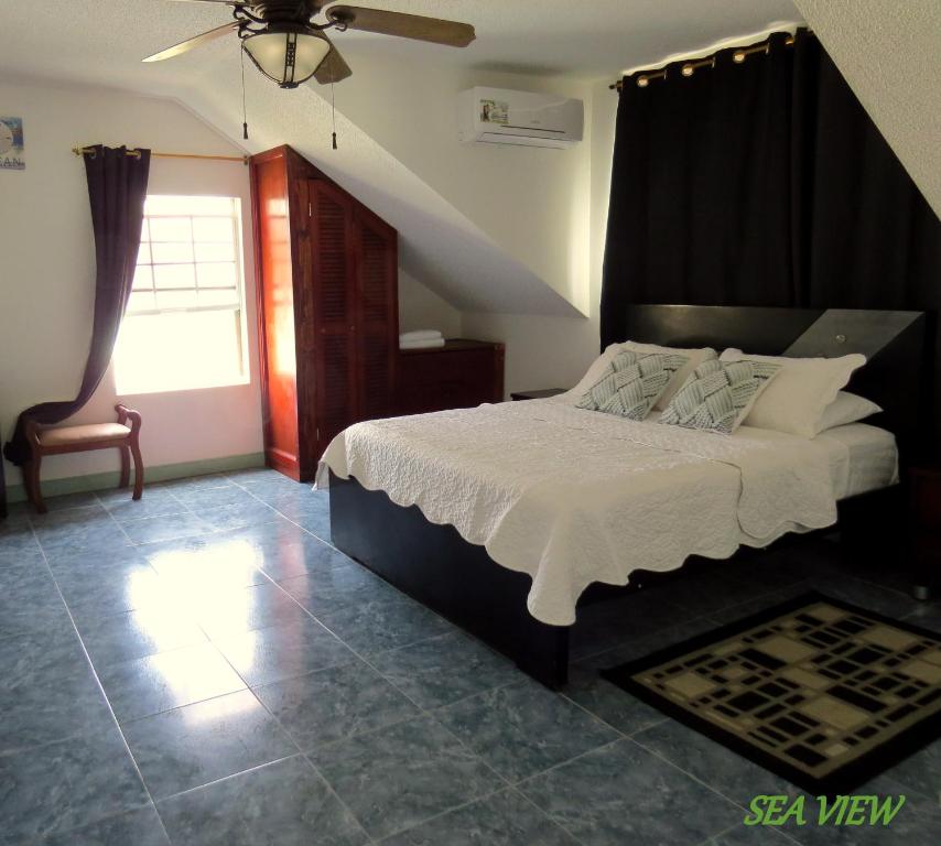 Cama ou camas em um quarto em Villa Sunny Days