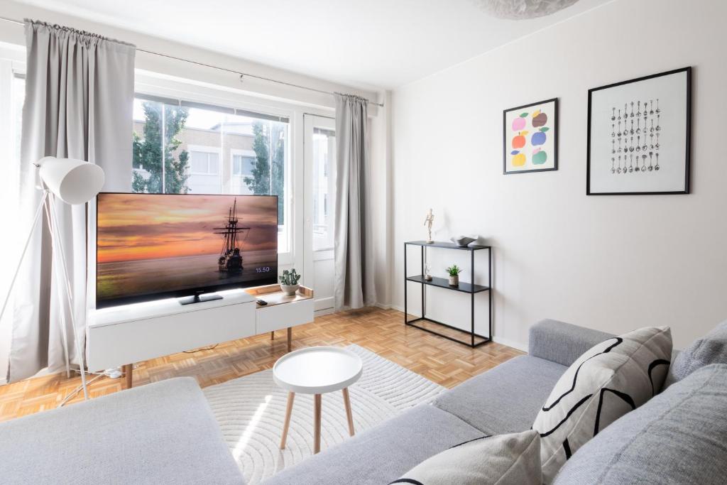 Posezení v ubytování Cosy downtown apartment with balcony