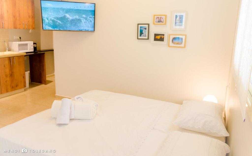 Postel nebo postele na pokoji v ubytování Rom HaTayelet