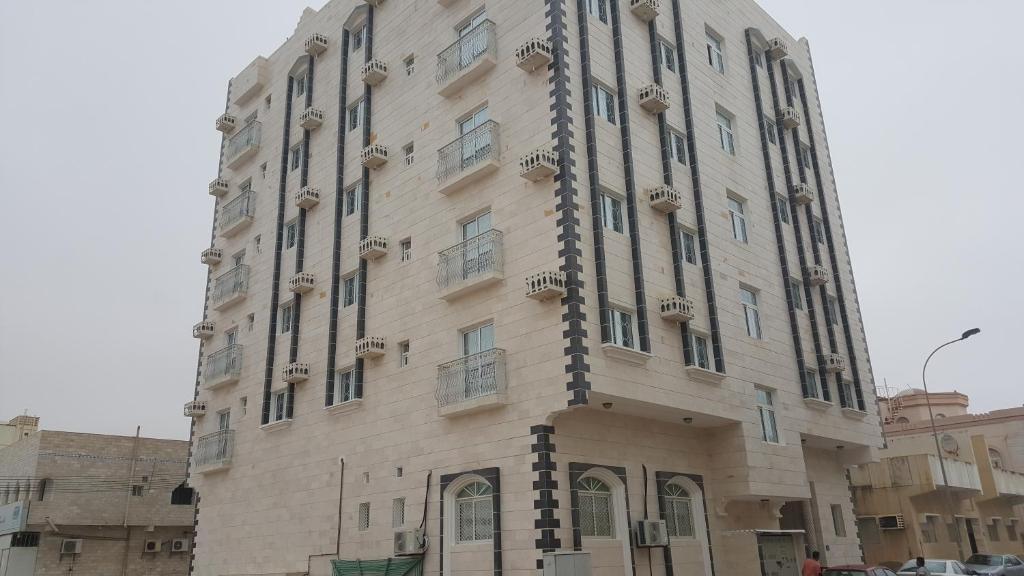 a large building in the middle of a city at Golden Seasons Furnished Apartment - 2 in Salalah