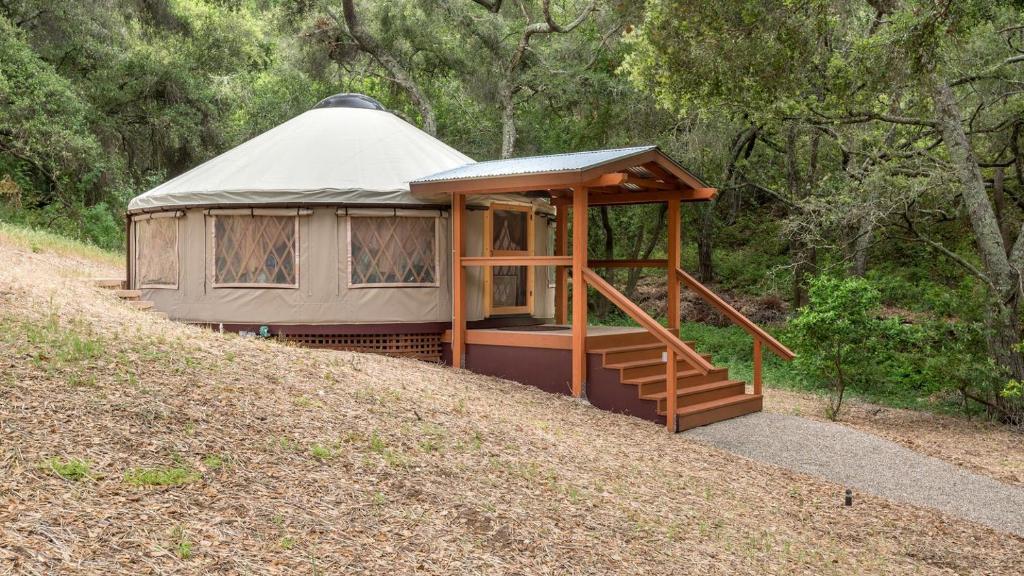 a gazebo on a hill in a forest at Tranquil Yurt Rental for Two with Soothing Interior on Ranch near San Luis Obispo in Cayucos