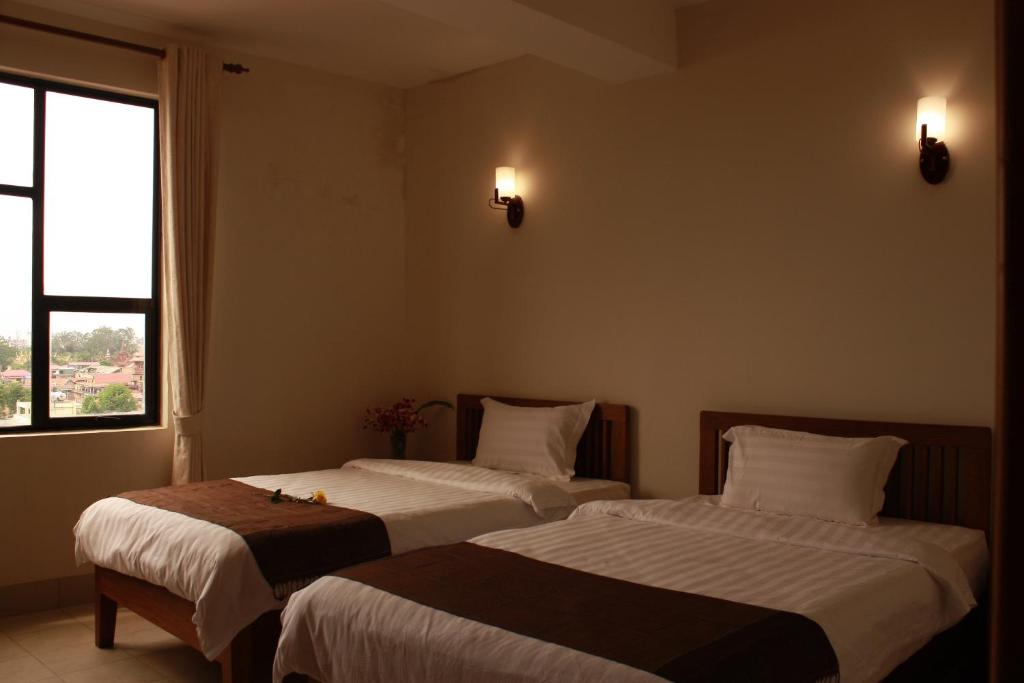 Postel nebo postele na pokoji v ubytování Lux Riverside Hotel & Apartment