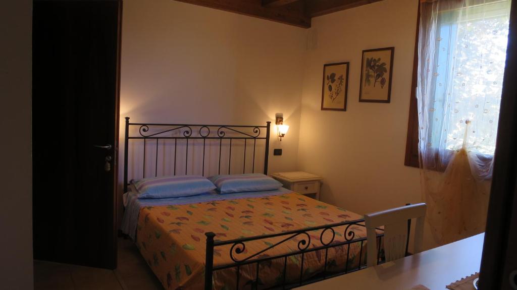 Posteľ alebo postele v izbe v ubytovaní Agriturismo L'Albara - Wines, Pool & SPA