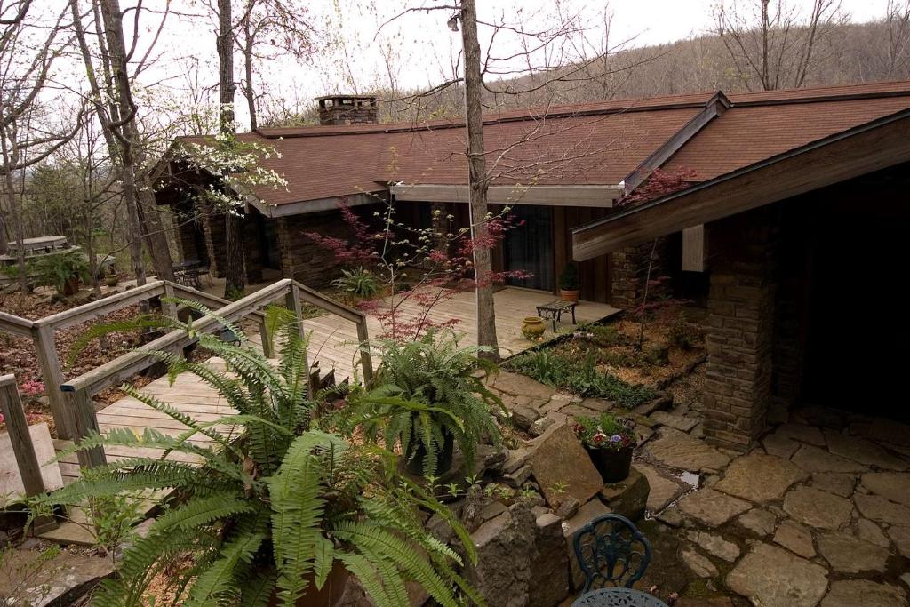a house with a porch and a patio at Fantastic Cabin Rental Perfect for a Family Vacation to Northwest Arkansas in Ponca