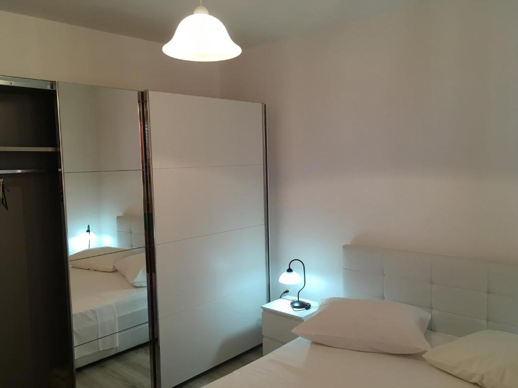 En eller flere senge i et værelse på Apartment Marina