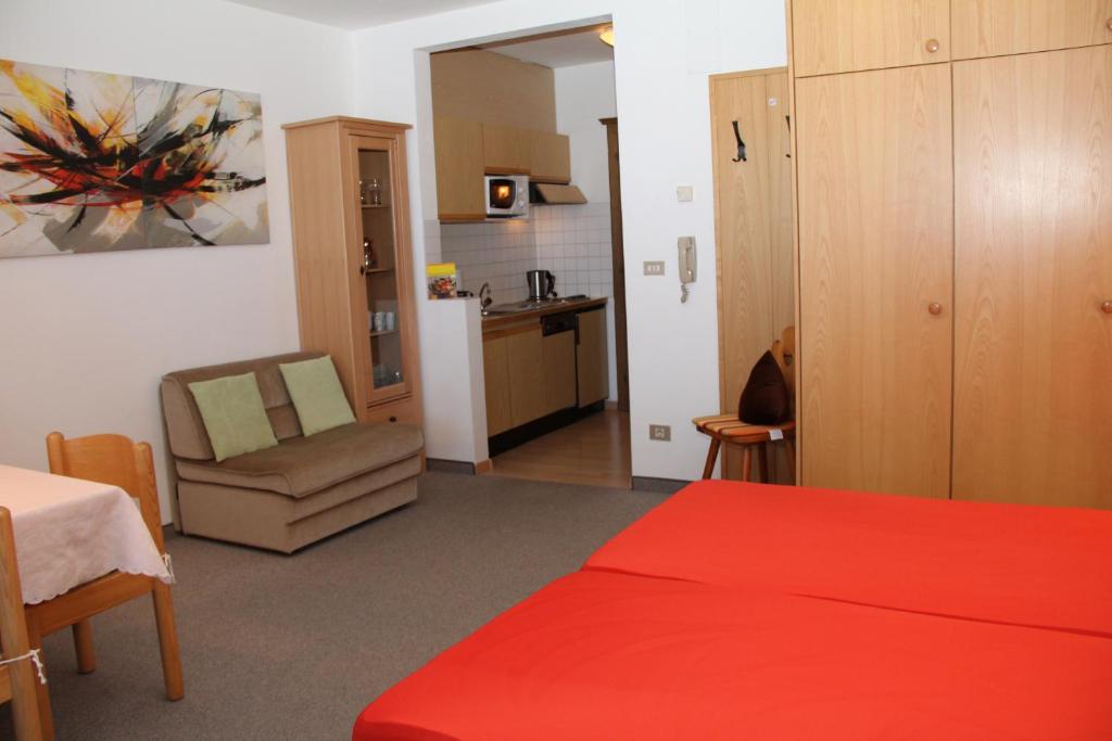 Łóżko lub łóżka w pokoju w obiekcie Alpina Residence