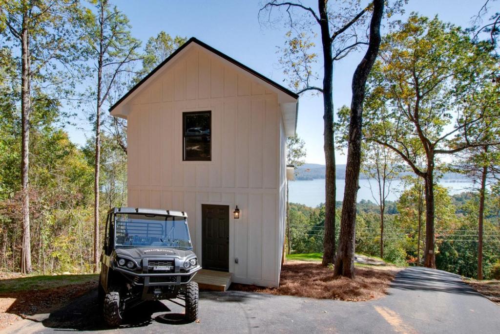 a jeep parked in front of a small building at Gorgeous Cabin Great for Groups or Families with Jacuzzi, Fire Pit and Views in Alabama in Grant